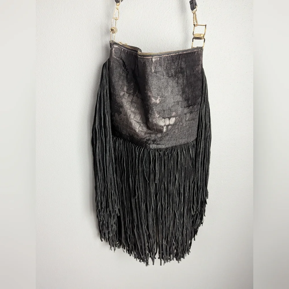 Black leather Fringe crossbody bag feels like cow leather. No tags. No brand tag
